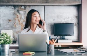 Woman on the phone in a CPA Frim in Houston 